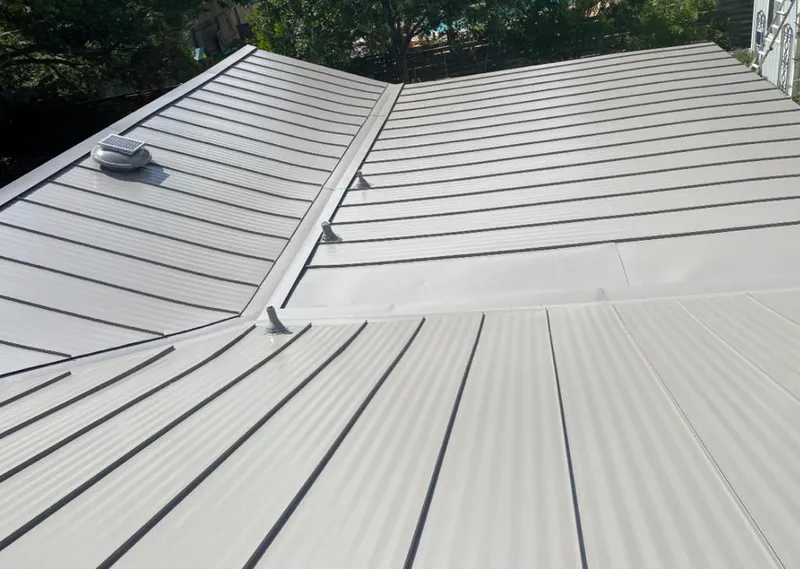 Solar attic fan installed on a metal roof for Roof Ventilation in Waconia